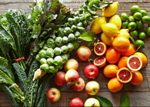 a group of fruits and vegetables on a wood surface Healthy Weight Loss Diets Northwood